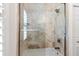 Contemporary bathroom featuring a glass shower, sleek fixtures, and light tile at 703 Monte Cristo Blvd, Tierra Verde, FL 33715