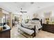 Spacious main bedroom with a large window, featuring an elegant bed and stylish furnishings at 703 Monte Cristo Blvd, Tierra Verde, FL 33715