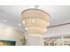 A unique woven chandelier illuminates the space adding charm and sophistication to the interior design at 703 Monte Cristo Blvd, Tierra Verde, FL 33715