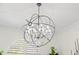 A crystal chandelier with a cage adds a touch of elegance to the room's decor at 703 Monte Cristo Blvd, Tierra Verde, FL 33715
