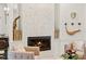 Cozy fireplace with white tiled surround creating a warm and inviting atmosphere at 703 Monte Cristo Blvd, Tierra Verde, FL 33715