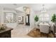 Inviting foyer leading to a dining room with modern chandelier and an open living area at 703 Monte Cristo Blvd, Tierra Verde, FL 33715