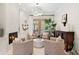 Bright living area featuring a fireplace, modern decor, and an inviting atmosphere at 703 Monte Cristo Blvd, Tierra Verde, FL 33715