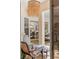 Cozy outdoor seating area with stylish lighting, and furniture adjacent to the dining area with a view of the pool at 703 Monte Cristo Blvd, Tierra Verde, FL 33715