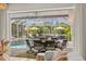 A screened lanai overlooks the pool and outdoor entertaining area, perfect for enjoying the Florida lifestyle at 703 Monte Cristo Blvd, Tierra Verde, FL 33715