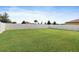 Large backyard with green grass and a white fence at 7170 Samuel Ivy Dr, Tampa, FL 33619