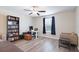 Bedroom featuring wood floors, a ceiling fan, and a window at 7170 Samuel Ivy Dr, Tampa, FL 33619