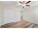 Bedroom with wood floors, closet and door to the Primary bathroom at 7170 Samuel Ivy Dr, Tampa, FL 33619
