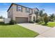 Charming two-story home with a well-maintained lawn and driveway at 7170 Samuel Ivy Dr, Tampa, FL 33619