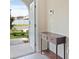 Foyer view with tile flooring, entry table, and natural light streaming in at 7170 Samuel Ivy Dr, Tampa, FL 33619