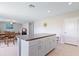 Open concept kitchen features island with breakfast bar and additional storage at 7170 Samuel Ivy Dr, Tampa, FL 33619