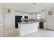Modern kitchen boasts white cabinetry, granite counters, and stainless steel appliances at 7170 Samuel Ivy Dr, Tampa, FL 33619