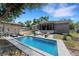 Backyard with pool, patio and lawn furniture at 7222 N Amos Ave, Tampa, FL 33614