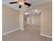 Open-concept living room with tile flooring, neutral paint, and modern ceiling fan with light at 7222 N Amos Ave, Tampa, FL 33614