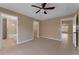 Main bedroom suite with en-suite bathroom and walk-in closet, featuring tile flooring and neutral walls at 7222 N Amos Ave, Tampa, FL 33614
