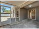 Large screened patio with concrete flooring and view of the fenced-in backyard at 7222 N Amos Ave, Tampa, FL 33614