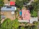 Aerial view of home with a swimming pool, outbuilding and a lush surrounding landscape at 7507 Beasley Rd, Tampa, FL 33615