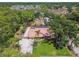 Aerial view of a beautiful single-Gathering home with a long driveway and lush landscaping at 7507 Beasley Rd, Tampa, FL 33615