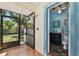 Quaint pool-access bathroom with modern vanity, toilet, and convenient shower outside of the bathroom at 7507 Beasley Rd, Tampa, FL 33615