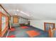 Bonus room featuring a skylight, corrugated metal, and red accents at 7507 Beasley Rd, Tampa, FL 33615