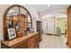 Entryway featuring tile flooring, archways, and an antique mirror with decorative wood chest at 7507 Beasley Rd, Tampa, FL 33615