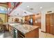 Well-equipped kitchen with stainless steel appliances and a large island with bar seating at 7507 Beasley Rd, Tampa, FL 33615