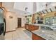 Bright kitchen with stainless steel appliances, granite countertops, and tile flooring at 7507 Beasley Rd, Tampa, FL 33615