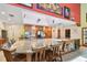Large kitchen island featuring barstool seating, sink, and wine storage at 7507 Beasley Rd, Tampa, FL 33615