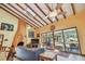 Vaulted ceiling living room with a fireplace and view to the outdoors at 7507 Beasley Rd, Tampa, FL 33615