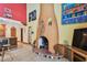Living room with unique fireplace, tile flooring, and colorful decor at 7507 Beasley Rd, Tampa, FL 33615