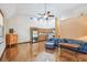 Open floor plan with wood floors, stainless steel appliances, and vaulted ceilings at 7507 Beasley Rd, Tampa, FL 33615
