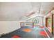 Bright loft with large round window and skylight, offering a unique and versatile space at 7507 Beasley Rd, Tampa, FL 33615