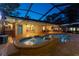 Lovely screened-in pool area with a bubbling spa and easy access to the home's interior at 7507 Beasley Rd, Tampa, FL 33615