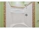 This is a shower featuring white walls and decorative tile accents at 7507 Beasley Rd, Tampa, FL 33615