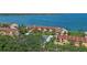 Scenic aerial perspective of waterfront condominiums with beautiful trees and bay views at 7520 Sunshine Skyway S Ln # 109, St Petersburg, FL 33711
