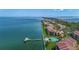 Magnificent aerial view of the waterfront condo community with scenic bridge and dock at 7520 Sunshine Skyway S Ln # 109, St Petersburg, FL 33711