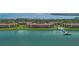 Beautiful aerial view showcasing waterfront condos, a pool, a private dock, and scenic bay views at 7520 Sunshine Skyway S Ln # 109, St Petersburg, FL 33711