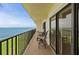 Private balcony features stunning water view and seating area with table and chairs at 7520 Sunshine Skyway S Ln # 109, St Petersburg, FL 33711