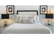 Bright bedroom with decorative pillows and modern lamps creates a relaxing ambiance at 7520 Sunshine Skyway S Ln # 109, St Petersburg, FL 33711