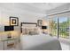 Cozy bedroom with balcony access provides a peaceful retreat with a water view at 7520 Sunshine Skyway S Ln # 109, St Petersburg, FL 33711