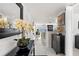 Bright hallway with tile flooring leads to an inviting living area with water views at 7520 Sunshine Skyway S Ln # 109, St Petersburg, FL 33711