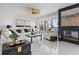 Comfortable living room featuring modern decor, lots of light, and views of tropical foliage at 7520 Sunshine Skyway S Ln # 109, St Petersburg, FL 33711