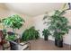 Bright sun room with tile flooring, seating, and lush greenery for a relaxing atmosphere at 7520 Sunshine Skyway S Ln # 109, St Petersburg, FL 33711