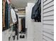 Spacious walk-in closet offers ample storage with built-in shelves and drawers at 7520 Sunshine Skyway S Ln # 109, St Petersburg, FL 33711