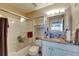 Bathroom with shower/tub combo, vanity, and mirrored medicine cabinet at 9481 Highland Oak Dr # 1511, Tampa, FL 33647