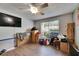 Bedroom with ceiling fan, tv, window and boxes at 9481 Highland Oak Dr # 1511, Tampa, FL 33647