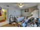 Bedroom with hardwood floors, ceiling fan, and view to bathroom at 9481 Highland Oak Dr # 1511, Tampa, FL 33647