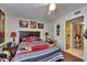 Bedroom features overhead lighting, wood flooring, and a doorway to the bathroom at 9481 Highland Oak Dr # 1511, Tampa, FL 33647