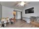Bedroom with ceiling fan, tv, laminate flooring, and lamps at 9481 Highland Oak Dr # 1511, Tampa, FL 33647