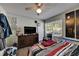 Bedroom with a large window, overhead fan, tv, and a chest of drawers at 9481 Highland Oak Dr # 1511, Tampa, FL 33647